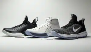 Trois paires de baskets de basketball aux prix différents posées sur une surface blanche, illustrant la technique prix basket et les gammes disponibles
